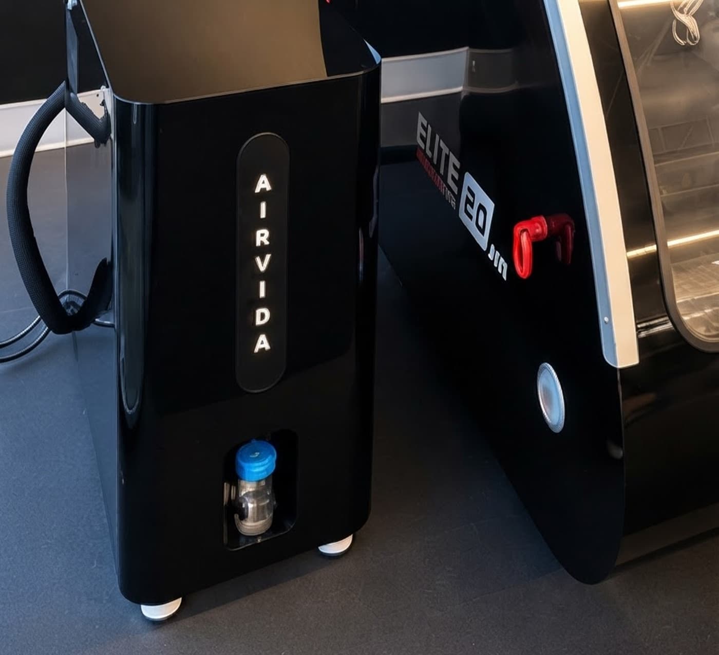 The Airvida oxygen unit beside the Airvida Elite chamber