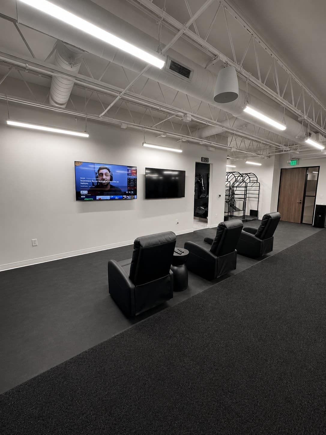 Member lounge with seating and screen